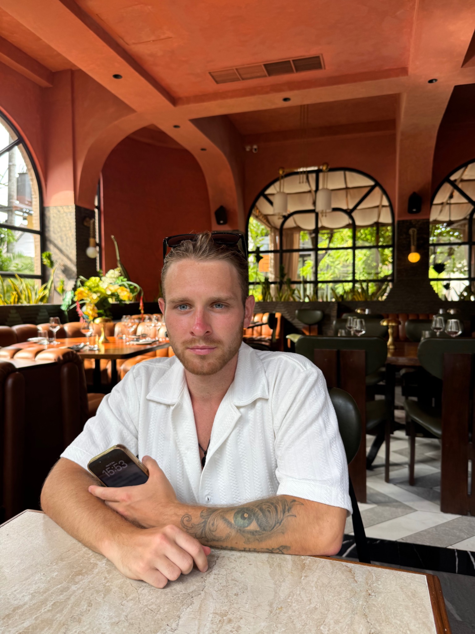 Harry Lever sitting in a restaurant